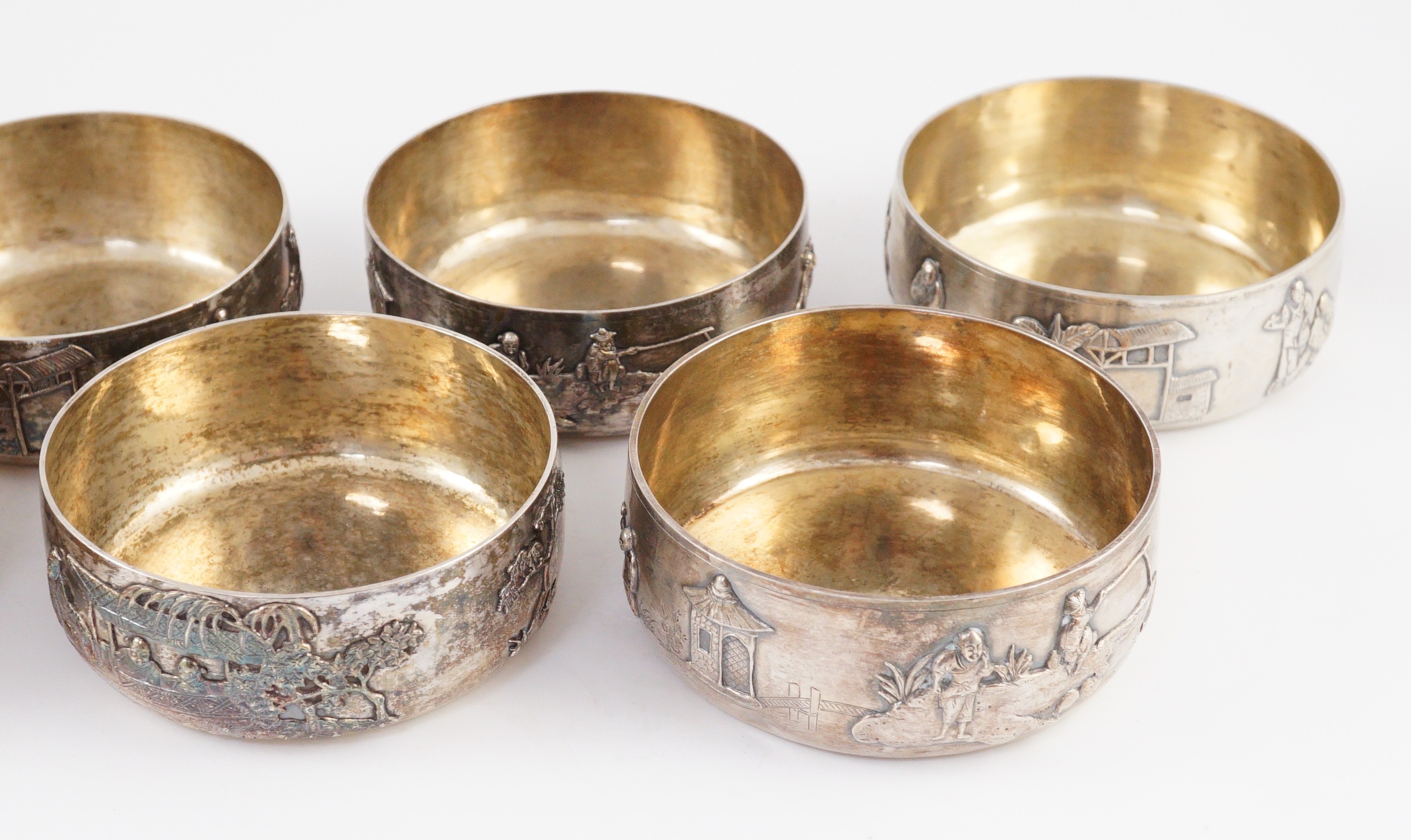 A set of four Chinese Export silver finger bowls, by Wang Hing, Hong Kong and one other set of four Chinese Export silver finger bowls